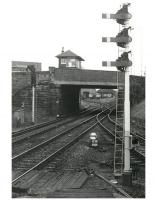 Looking south from the up platform at Newton-on-Ayr station in 1985, showing the massive signalbox which, for many years, towered above Prestwick road together with a fine collection of semaphore signals, alas all now gone! Ayr MPD stands in the background with a selection of diesel locomotives sharing the accommodation with DMU stock. <br>
<br><br>[Ken Browne //1985]