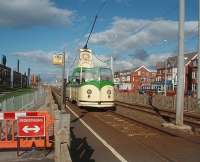 <I>Boat Car</I> No. 600, painstakingly restored for the Blackpool Tramway 125 celebrations, makes a fine sight as it leaves the stop at Lowther Avenue and heads along the cliffs to Bispham. Seven of these stylish open cars were built in 1934 to replace early open <I>toastrack</I> trams and must have been a real contrast to their predecessors. Three of them are still in regular service as part of Blackpool's heritage fleet. <br><br>[Mark Bartlett 16/10/2010]