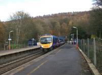 TransPennine DMU no 185110, having just cleared the west portal of Totley Tunnel, rushes through Grindleford Station on 7 November 2010.<br><br>[John McIntyre 07/11/2010]