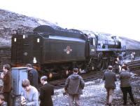 Britannia Pacific no 70013 <I>Oliver Cromwell</I> backs onto the BR (Scottish Region) Easter Grand Tour at Hellifield on 13 April 1968. The Pacific took the train on to Stockport via Blackburn, Bolton and Manchester.<br><br>[Jim Peebles 13/04/1968]