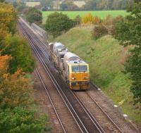 An MPV on RHTT duties heads south east through rural Kent at Tutt Hill, to the north west of Ashford, on 28 October 2010. The large wall behind the MPV to the right of the line is part of a bridge over the M20 Motorway.<br>
<br><br>[John McIntyre 28/10/2010]