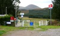Entrance to Achanalt station in October 2009. View south over the car park alongside the A832 road.  <br><br>[John Furnevel 01/10/2009]
