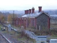 An early wet autumn morning view of the extant former Aberdare High Level station building, looking in very good condition and still with its canopy supports. Photographed looking north from the current <I>modern replacement</I> station in November 2010. [See image 19535] <br><br>[David Pesterfield 09/11/2010]