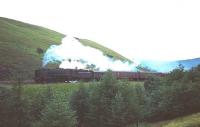 A <I>Britannia</i> Pacific with a down train photographed on Beattock bank in the 1960s. The train is seen at Harthope heading for the summit. <br><br>[Robin Barbour Collection (Courtesy Bruce McCartney) //]