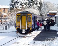 <I>Careful now - mind you don't slip.. </I> Passengers tentatively  disembarking from a Glasgow Central arrival at a snowy East Kilbride station during the late morning on 2 December 2010<br>
<br><br>[John Steven 02/12/2010]