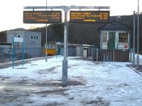 The 15.08 mixed Pacer service from Merthyr Tydfil seen between the old and new 'signalling centres' at Abercynon on 9 December 2010. The train continues south from here as the 15.29 service to Barry Island [see image 25614].<br><br>[David Pesterfield 09/12/2010]