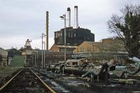 The last substantial section of the LNWR Watford to Rickmansworth branch to survive in traffic served John Dickinson's Croxley paper mill for the delivery of fuel oil. This view of the mill, taken on 26th December 1977, shows the sidings and transshipment facilities. Trains ran until the mill closed in December 1980, after which it was demolished for new housing.<br><br>[Mark Dufton 26/12/1977]