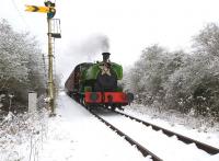 Scene on the Swindon and Cricklade Railway near Hayes Knoll on 18 December with Barclay 0-6-0ST <I>Salmon</I> heading through the snow with a <I>Santa Special</I>.<br><br>[Peter Todd 18/12/2010]