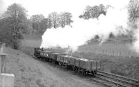 <I>Careful with that!</I>  0-4-0ST <I>Dailuaine</I>, seen here in charge of a precious cargo near the Dailuaine distillery between Carron and Aberlour on the Speyside line in the 1960s.<br><br>[Robin Barbour Collection (Courtesy Bruce McCartney) //]