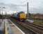 As the Class 37s celebrate fifty year's of main line service, two slightly younger members hustle a pair of flasks north through Bank Quay station. Still in front line service with DRS, second loco 37607 is approaching its birthplace, Vulcan Foundry, from where it emerged in January 1963 as D6803. Leading loco 37602 left Robert Stephenson & Hawthorn's plant in Newcastle two months earlier as D6782. <br><br>[Mark Bartlett 04/11/2010]