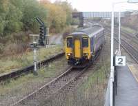 <I>The world's first railway junction</I> is the claim made on behalf of this spot at Earlestown where, in 1831, the Warrington and Newton Railway met the one year old Liverpool and Manchester line. Northern 156488, heading for Warrington Bank Quay, has just left the L&M and is running into the surviving Warrington and Newton platform. View towards Huyton and Liverpool from the surviving section of the station footbridge. [See image 25335] <br><br>[Mark Bartlett 04/11/2010]