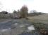 The product of the late-Victorian Binnend Oilworks was sent off on its two mile branch to join the network immediately north of Kinghorn station. Some of it however didn't get that far as there was a candle factory on the branch. The building survived until recently. This is the site of it looking east on 6 November. The line curved round to the right, where that fence now is, and passed where I'm standing.You'll have to imagine the walrus moustaches, gormless expressions and total disregard for health and safety.<br>
<br><br>[David Panton 06/11/2010]