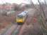 The Heysham Boat Train ambles down the branch to the Port. 144013 is allowed 15 minutes for the four mile journey from Morecambe so, even with the manual points change at the junction [See image 18085] the pace is leisurely. This picture was taken looking north from Regent Rd bridge. <br><br>[Mark Bartlett 22/11/2010]