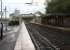 Platform view east from Hazel Grove station on 19 October 2010. The route diverging to the left beyond the road bridge is for New Mills South Junction with the line to Buxton running straight ahead.<br>
<br><br>[John McIntyre 19/10/2010]