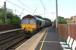 DBS 66016 arrives at Euxton Balshaw Lane station with a charter train to Ayr on 3 July 2010. The platforms here can cope with a 4 coach multiple unit so a loco hauled 13 coach special does restrict the number of doors by which passengers can board the train. However, this was a better arrangement than the return journey when the train sailed passed the station on the fast lines - which have no platforms.<br>
<br><br>[John McIntyre 03/07/2010]