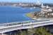 View from King's Park over South Perth with a Transperth emu bound for Mandurah in September 2010. These trains do not serve Perth Central, instead burrowing down a new line via Perth Underground and Esplanade stations. This line is of recent construction and uses the median of the freeway at this point.<br>
<br><br>[Colin Miller 26/09/2010]