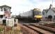 A morning Dundee - Edinburgh Waverley service runs over the level crossing at Errol in November 2006.<br><br>[John Furnevel 15/11/2006]