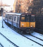 On its way to Neilston on 27 November 314 212 leaves Mount Florida <br>
station behind. Mount Florida is the station for Hampden Park and on some match days at least sees non-stopping football specials from Glasgow Central: not a tremendous distance. For a Scottish name Mount Florida is quite comprehensible, showing that it is not ancient, going back no further than the early 1800s.<br><br>[David Panton 27/11/2010]