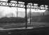 General view over the yard of the large Trafford Park shed, Manchester, in the sixties. Originally built as a 20-road straight dead-end shed it was used by locomotives of the MR, GNR and GCR and contained multiple coal stages, water tanks and turntables. The decaying shed, latterly coded 9E, was eventually closed in 1968 and demolished by 1975. A Freightliner container depot was later built on the site.  <br><br>[Jim Peebles //]