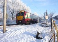 An Edinburgh Waverley - Helensburgh Central train formed by 334 001 heads west from Airdrie station on the afternoon of 23 December 2010.<br><br>[John Steven 23/12/2010]