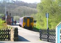 View from the bottom of the footbridge stairs at Grosmont on 20 April 2009 as the Northern 10.38 <I>Esk Valley Line</I> DMU from Middlesbrough arrives at platform 1 on a service to Whitby.<br><br>[John Furnevel 20/04/2009]