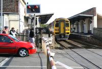A Northern 158 clears River Head Drive level crossing and pulls into Driffield station on 1 October 2008 with the late running 07.39 Gilberdyke - Scarborough service.<br><br>[John Furnevel 01/10/2008]