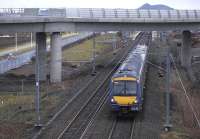 170414 passes underneath the new tramway bridge at Edinburgh Park on 5 January with a Glasgow Queen Street service. Tram rails have been installed on the bridge and approach earthworks completed.<br>
<br><br>[Bill Roberton 05/01/2011]