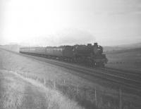 St Margarets B1 no 61029 <I>Chamois</I> appears out of the fog between Hassendean and Hawick on 9 November 1963 with the 12.52pm Edinburgh Waverley - Hawick train.<br>
<br><br>[Robin Barbour Collection (Courtesy Bruce McCartney) 09/11/1963]