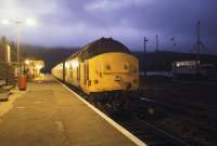 A class 37 stands at Kyle of Lochalsh with empty stock on the evening of 30 August 1987.<br><br>[Ian Dinmore 30/08/1987]