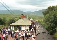 Scene at Rannoch station looking north from the footbridge on 7 August 1994 with the SRPS <I>West Highland Centenary Special</I> from Edinburgh to Fort William at the platform ....which is just a wee bit busier than usual...<br><br>[John McIntyre 07/08/1994]