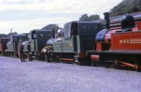 A line up of Isle of Man Railway motive power on display at Douglas station in 1969. Even at this time several of these locomotives were non-operational. Nearest the camera is the unique Manx Northern Railway 0-6-0T No. 15 <I>Caledonia</I> and in front of that the oldest locomotive in the fleet, 2-4-0T No. 1 <I>Sutherland</I>. Ahead of No. 1 are three further locomotives that appear to be No. 8 <I>Fenella</I>, No. 6 <I>Peveril</I> and an unidentified example in maroon livery.  <br><br>[David Hindle //1969]