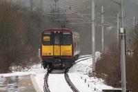 314206 departing Whinhill for Wemyss Bay on a snowy 12th January 2011. At one time there were two running lines here, with the second down line passing through the area on which the station now stands. [see image 9586]<br><br>[Graham Morgan 12/01/2011]