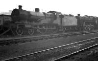 Locomotives in the sidings alongside Derby Works, thought to have been photographed in March 1958. The numbers are unreadable but the Compound is most likely no 40928, which was withdrawn from Saltley shed and scrapped at Derby that same month. The Caprotti standard class 5 is probably awaiting attention in the works.<br><br>[K A Gray /03/1958]