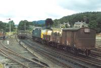 The Perth - Blair Atholl pick-up goods at Pitlochry in 1972. Class 26 no 5340 is backing the leading part of its train past some coal wagons prior to shunting them into the sidings on the left. <br><br>[Bill Roberton //1972]