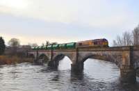 67007 crossing the viaduct over the River Conon with the tanker train for Lairg on 5 February 2011.<br>
<br><br>[John Gray 05/02/2011]