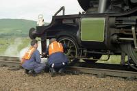 The crew of ex LNER K4 no 3442 <I>The Great Marquess</I> checking the pony truck of the locomotive during an extended station stop at Rannoch on 07 August 1994 whilst working the <I>West Highland Railway Centenary</I> special to Fort William.<br>
<br><br>[John McIntyre 07/08/1994]