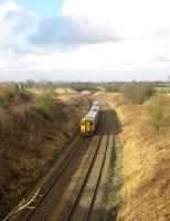A Northern service from Leeds to Blackpool North has just climbed <br>
Hoghton bank and is now rounding the curve towards the former Hoghton station on 12 February 2011. The city of Preston is just visible on the skyline.<br><br>[John McIntyre 12/02/2011]