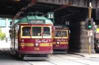 Two City Circle W-class trams pass in Flinders Street on 7 October 2008. This free service for tourists also attracts the locals. The bridge carries the railway lines linking Flinders Street Station to Spencer Street, now called Southern Cross.<br>
<br><br>[Colin Miller 07/10/2008]