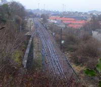 Abbeyhill Junction is where the bidirectional lines from the east of <br>
Waverley Station through Calton tunnels (just one track per tunnel) <br>
resolve into the Up and Down ECML. In the middle distance the Abbeyhill Loop and line to Leith once also veered off to the left, but the connection was broken in the early 1990s. View east from Regent Road park on 12 February with the floodlights of Meadowbank Stadium on the horizon.<br><br>[David Panton 12/02/2011]