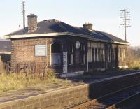 The board on the west end wall of Duddingston andCraigmillar station (closed 1962) proclaims that it deals with goods and parcels traffic but the dilapidated condition of the building suggests <br>
otherwise. Photographed on Sunday 22nd November 1970.<br>
<br><br>[Bill Jamieson 22/11/1970]