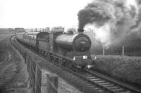 The SLS <I>'Farewell to Peebles'</I> railtour with J37 0-6-0 no 64587 in charge captured shortly after leaving Pomathorn en route to its next stop at Leadburn on Saturday 3rd February 1962, the last day of passenger services over the line. Pomathorn paper Mill (closed in 1975) can be seen in the left background [see image 23614]. <br><br>[Frank Spaven Collection (Courtesy David Spaven) 03/02/1962]