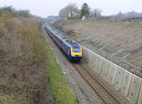 A First Great Western HST southbound, one mile out of Kemble Station heading towards Swindon on 22 February 2011. Note the repairs to the previously collapsed embankment so vividly shown in the image. Neither a classic nor a traditional repair, but very effective.<br>
<br><br>[Peter Todd 22/02/2011]
