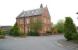 The impressive former station house at Ripon looking south east from the junction of Station Close and Station Drive in April 2009. The equally impressive main station building, now converted to residential accommodation, stands to the right beyond the trees [see image 23883]. <br><br>[John Furnevel 24/04/2009]