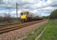 334009 heads east alongside the sea wall at Craigendoran with a service to Airdrie on 28 May 2007.<br>
<br><br>[John McIntyre 28/05/2007]