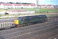 Class 40 no 239 in the down sidings north of Berwick station at the head of a train of pre-fabricated, concrete-sleepered, track panels. Photographed on a bright Saturday morning in September 1970.<br><br>[Bill Jamieson 12/09/1970]