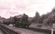 Ex-LMS 8F 2-8-0 no 48305 running through Consall on the Churnet Valley Railway in July 2004.<br><br>[Peter Todd 03/07/2004]