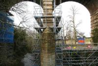 Scaffolding and work platforms in place around the northern section of Newbattle Viaduct spanning the South Esk on 5 March 2011. The 1847 structure will carry trains on the Borders Railway over its 0.5km length from 2014. [Work to be carried out includes pointing & repair of masonary piers, replacement of broken rail banding around piers, repair and replacement of brickwork and replacement of frost-damaged coping stones.] [See image 42764]<br>
<br><br>[John Furnevel 05/03/2011]