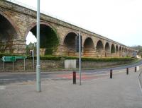 The 23-arch Newbattle Viaduct, looking north in March 2011. Destinations on the sign once applied to both road and rail routes. The structure must hold a record for the number of names by which it has become known over the 164 years since it was built. Apart from Newbattle, the names Newtongrange, Lothianbridge, South Esk and Dalhousie Viaduct are amongst those commonly attributed. [See image 33034].<br>
<br><br>[John Furnevel 05/03/2011]
