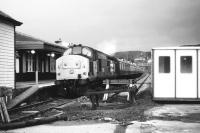 Having recently arrived with a train from Inverness, no 37415 stands at the platform at Kyle of Lochalsh under ever darkening skies on an August afternoon in 1987.<br>
<br><br>[John McIntyre /08/1987]