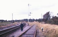The lamp man cometh... railwayman carrying lamps for signals at Claremorris, County Mayo, in 1988.<br><br>[Ian Dinmore //1988]